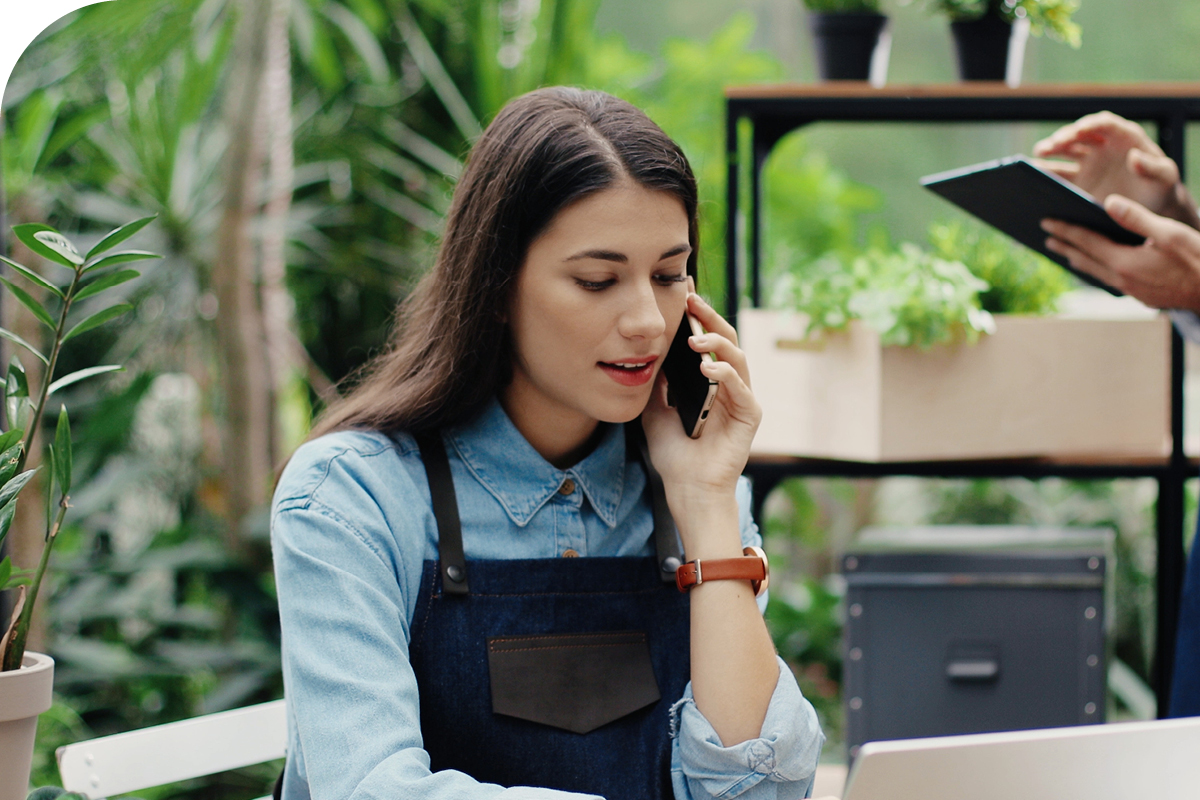 Business owner on the phone with a vendor